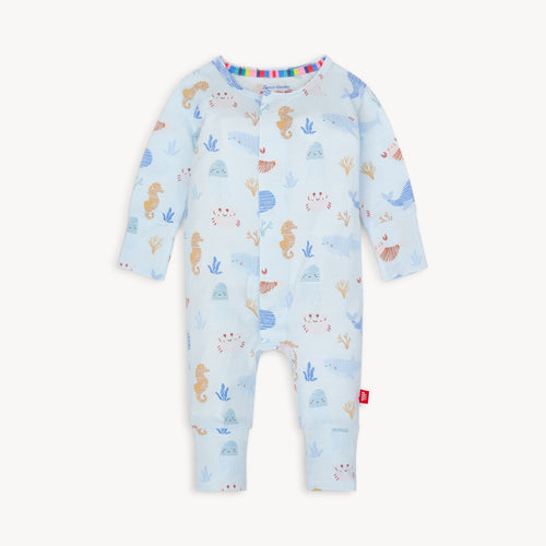 Wrap your little one in the soft and comfortable Deep Sea Jubilee Pajama Footie by Magnetic Me. With its magnetic closure and soft modal fabric, changing time will be a breeze. The adorable under the sea motif adds a touch of cuteness to any wardrobe and the convertible leg makes these perfect for day into night to cover little feet!