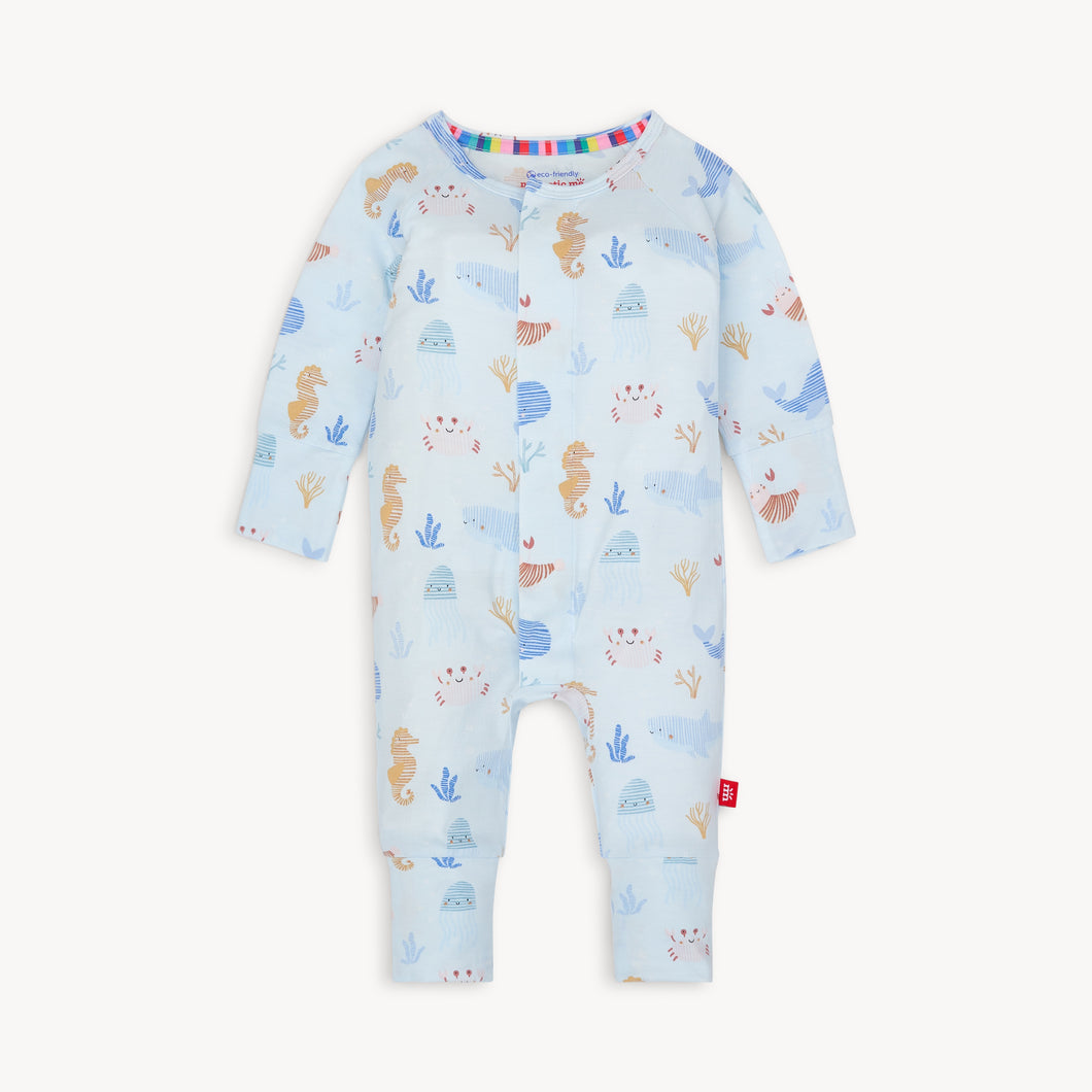 Wrap your little one in the soft and comfortable Deep Sea Jubilee Pajama Footie by Magnetic Me. With its magnetic closure and soft modal fabric, changing time will be a breeze. The adorable under the sea motif adds a touch of cuteness to any wardrobe and the convertible leg makes these perfect for day into night to cover little feet!
