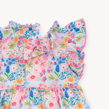 Load image into Gallery viewer, Experience the beauty of spring in our Lily Vibrant Floral Dress from Magnetic Me. Featuring a stunning floral pattern, cute puffy sleeves, and a charming tiered skirt, this dress is perfect for your little one. Plus, smaller sizes come with a convenient diaper cover.
