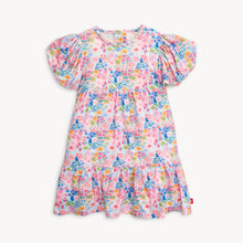 Load image into Gallery viewer, Experience the beauty of spring in our Lily Vibrant Floral Dress from Magnetic Me. Featuring a stunning floral pattern, cute puffy sleeves, and a charming tiered skirt, this dress is perfect for your little one. Plus, smaller sizes come with a convenient diaper cover.
