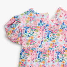 Load image into Gallery viewer, Experience the beauty of spring in our Lily Vibrant Floral Dress from Magnetic Me. Featuring a stunning floral pattern, cute puffy sleeves, and a charming tiered skirt, this dress is perfect for your little one. Plus, smaller sizes come with a convenient diaper cover.
