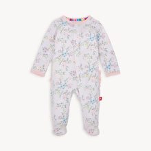 Load image into Gallery viewer, Experience the convenience and beauty of the Emily Floral Footie Pajama from Magnetic Me! The magnetic front closure makes dressing effortless for parents, while the ruffled back adds a touch of sweetness. The lovely lavender and floral design will have your little one looking adorable and feeling cozy all night long.
