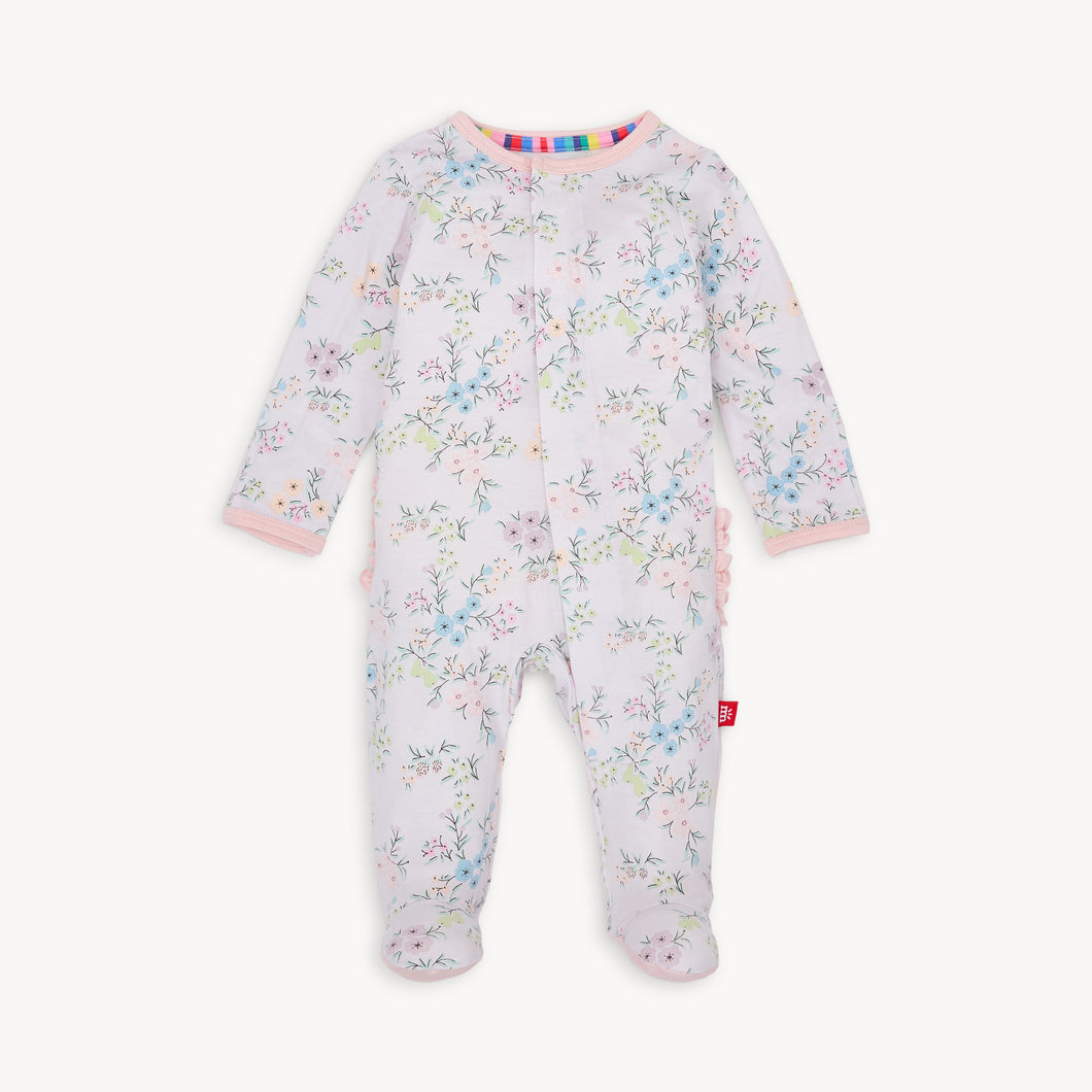 Experience the convenience and beauty of the Emily Floral Footie Pajama from Magnetic Me! The magnetic front closure makes dressing effortless for parents, while the ruffled back adds a touch of sweetness. The lovely lavender and floral design will have your little one looking adorable and feeling cozy all night long.