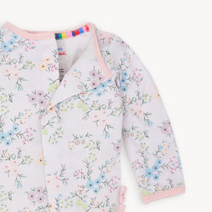 Experience the convenience and beauty of the Emily Floral Footie Pajama from Magnetic Me! The magnetic front closure makes dressing effortless for parents, while the ruffled back adds a touch of sweetness. The lovely lavender and floral design will have your little one looking adorable and feeling cozy all night long.