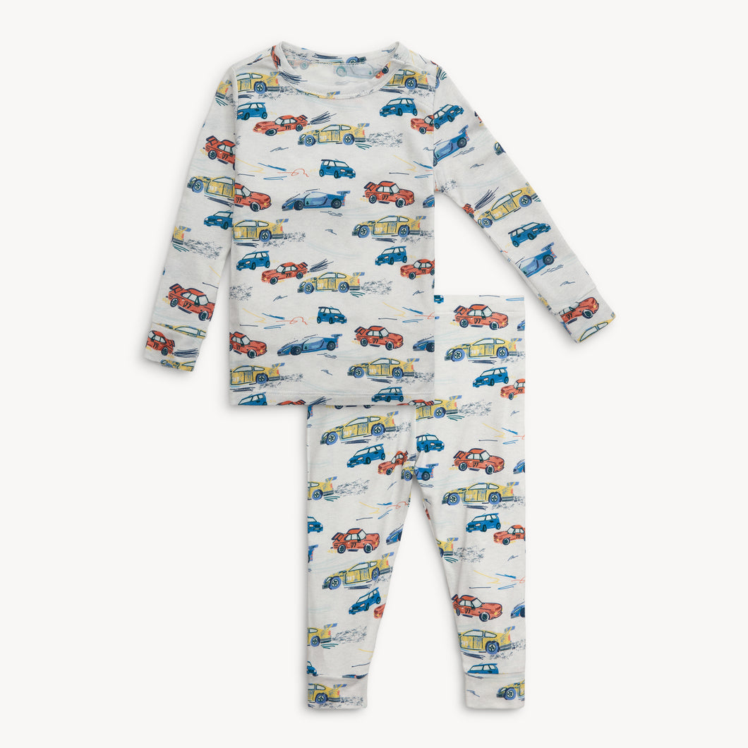 Give your little one the ultimate comfort and style with Lap of Life Long Sleeve 2 Piece Pajamas. Made from the softest materials, these pajamas will keep your toddler cozy all night long. The adorable racecar print adds a fun touch that your little boy will love. Say hello to peaceful bedtime routines and happy mornings!