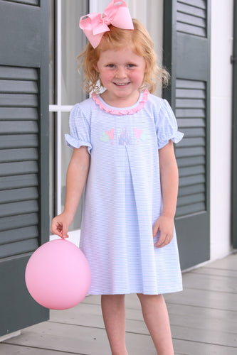 Dress your little one in enchantment with the Girls Magical Embroidered Dress from Trotter Street Kids. This charming dress includes a soft, short sleeve dress with delicate front pleats, and ruffle details. Adorned with embroidered Disney favorites, it brings a touch of magic to every adventure!