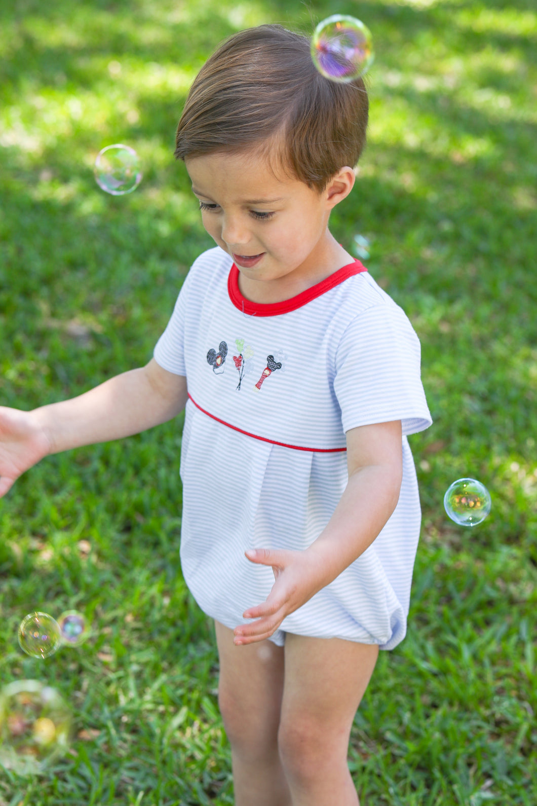 Add a touch of Disney magic to your little one's wardrobe with our Mouse Embroidery Boy's Bubble! Perfect for a trip to Disney or for any little Disney fan, this adorable outfit from Trotter Street Kids features charming mouse embroidery and playful bubble style. Make every day feel like a dream with this must-have outfit!