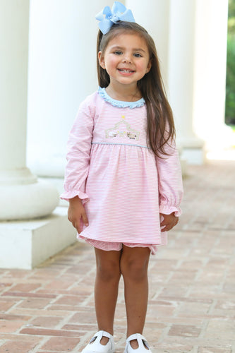 Dress your little one in festive charm with the Infant Girls Nativity Bloomer Set from Trotter Street Kids. This adorable outfit pairs a striped tunic with coordinating bloomer shorts, enhanced by delicate ruffle details. The beautifully embroidered nativity scene adds a meaningful touch, making it perfect for holiday celebrations and treasured photos. 
