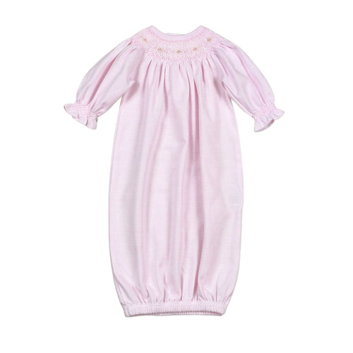 The Infant Girls Sally Pink Stripe Smocked Bishop Gown by Baby Loren combines timeless elegance with exceptional comfort. Crafted from 100% soft Pima cotton, this gown features delicate pink and white mini stripes and a beautifully smocked neckline adorned with hand-embroidered details. Perfect for your newborn, it offers gentle breathability and a classic style that keeps your little one cozy and charming for any special occasion.