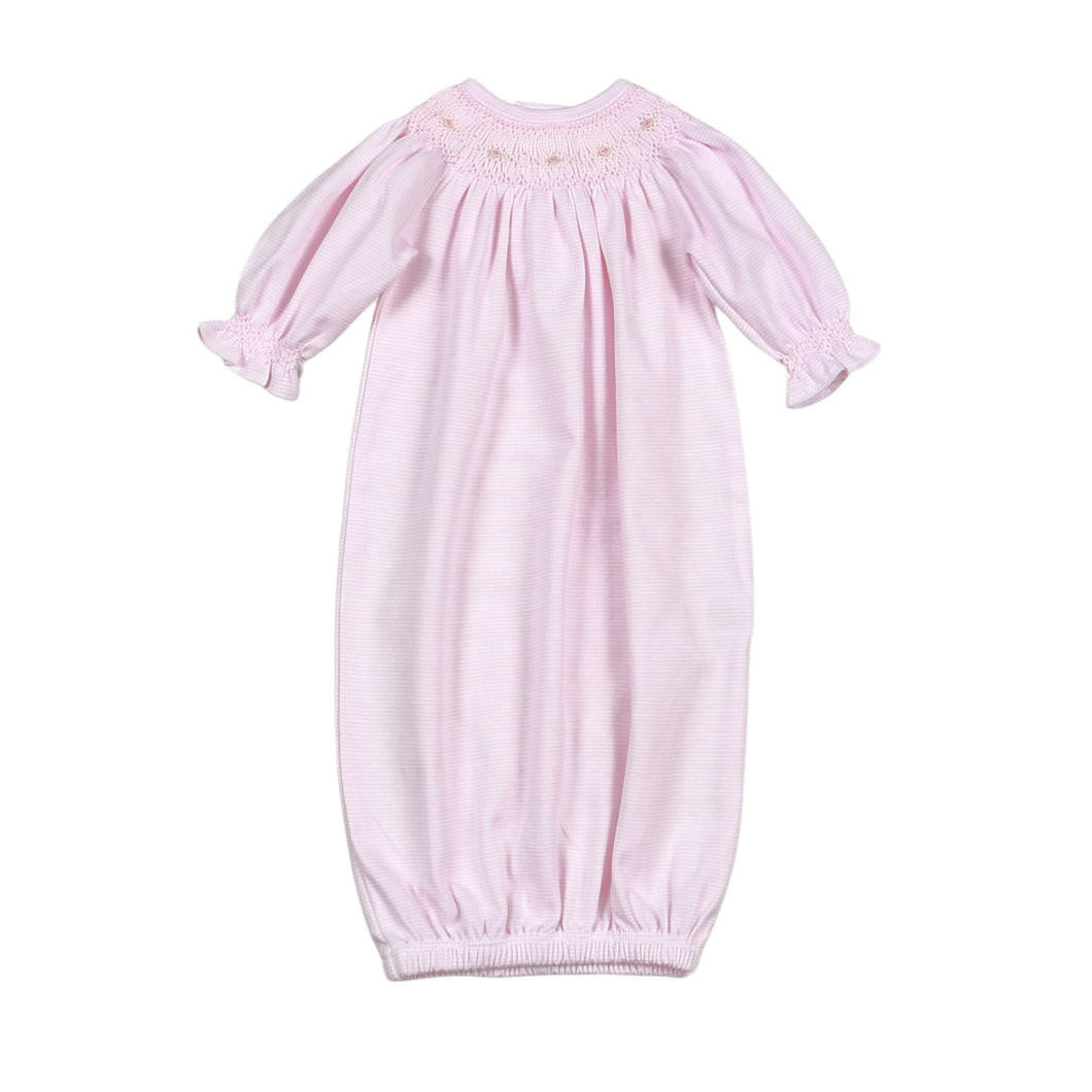 The Infant Girls Sally Pink Stripe Smocked Bishop Gown by Baby Loren combines timeless elegance with exceptional comfort. Crafted from 100% soft Pima cotton, this gown features delicate pink and white mini stripes and a beautifully smocked neckline adorned with hand-embroidered details. Perfect for your newborn, it offers gentle breathability and a classic style that keeps your little one cozy and charming for any special occasion.