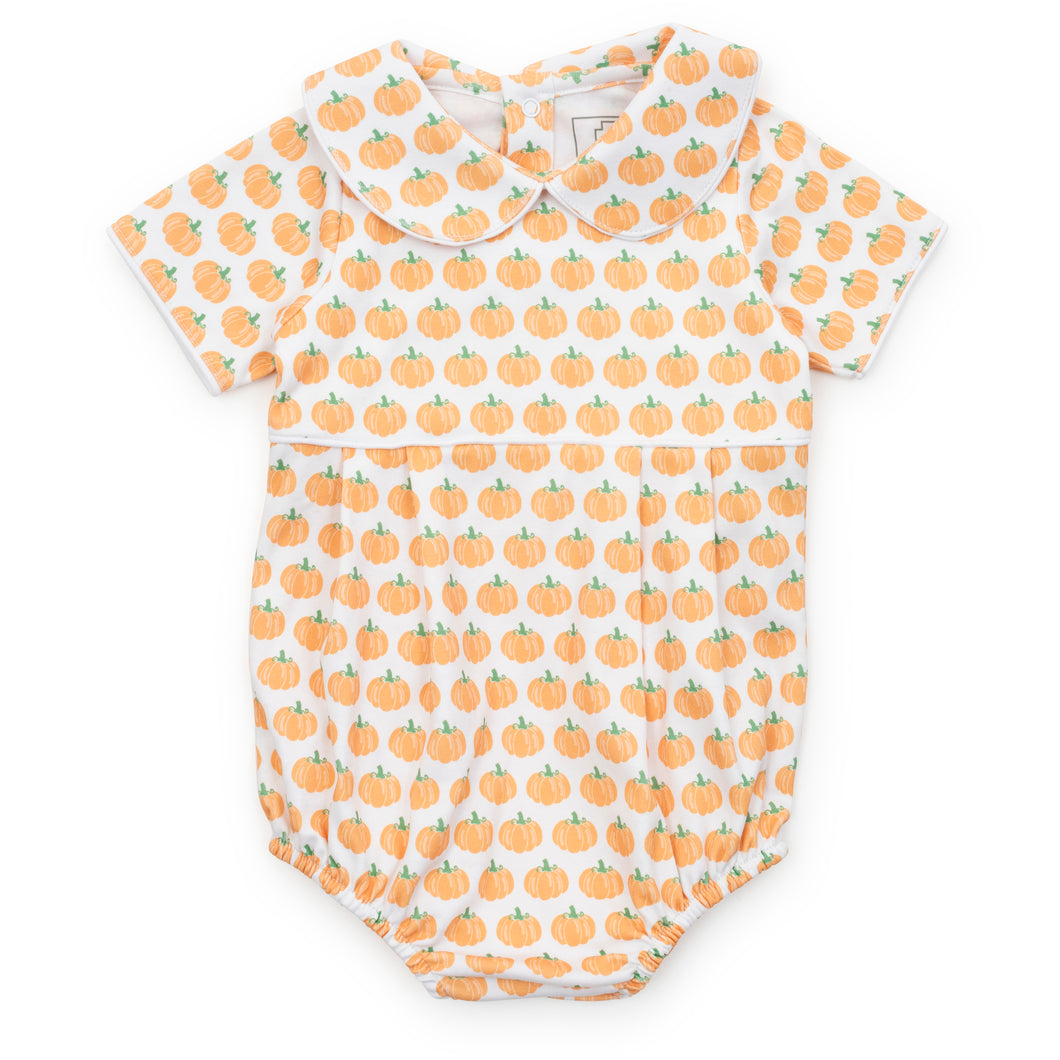 Dress your little one in the charming Harvest Pumpkin Bubble from Lila & Hayes. Featuring a delightful pumpkin print, a classic Peter Pan collar, and delicate piping detail, this bubble romper combines timeless style with cozy comfort. Perfect for festive occasions or everyday wear, it adds a touch of autumnal sweetness to your child's wardrobe.