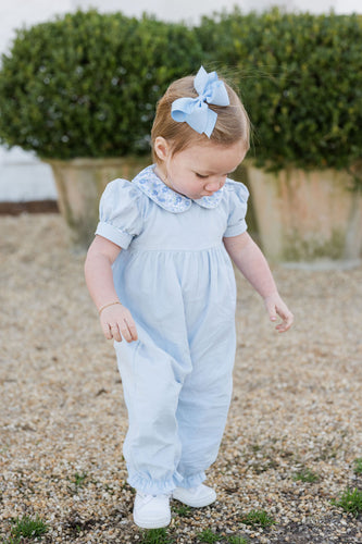 The Ava Blue Floral Payton Long Bubble from James & Lottie features a charming floral print collar that adds a touch of sweetness to her wardrobe. Designed with short sleeves and delicate details, this long bubble offers both comfort and style, making it perfect for any occasion this season. Dress her in this delightful piece to keep her looking effortlessly fashionable and comfortable all day long.