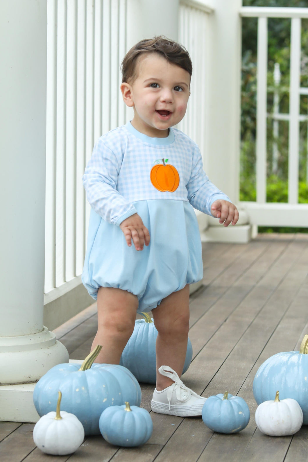 Dress your little one in charming style with the Infant Boys Long Sleeve Pumpkin Bubble from Trotter Street Kids. This adorable bubble features a blue and white gingham body adorned with playful appliqué pumpkin and classic style for fall.