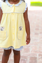 Load image into Gallery viewer, Let your little one prance around in playful style with this charming Puppy Paws Bloomer Set from Trotter Street Kids. The cheerful yellow tunic features adorable applique puppies sitting right on the side pockets—a delightful detail that captures every child's imagination. Paired with coordinating striped bloomers.
