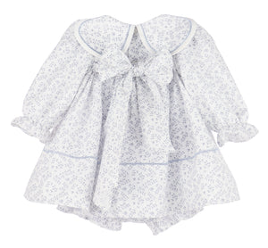 The Floral Branches Petal Float Dress from Sophie &amp; Lucas brings a charming touch to your little one’s wardrobe with its delicate blue and white floral pattern. Its petal scalloped collar adds a sweet, elegant detail, while the back tie ensures a comfortable, adjustable fit. Available in sizes from infant to toddler, this dress is the ideal choice for family photos, capturing timeless memories with style and grace.