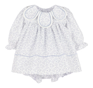 The Floral Branches Petal Float Dress from Sophie &amp; Lucas brings a charming touch to your little one’s wardrobe with its delicate blue and white floral pattern. Its petal scalloped collar adds a sweet, elegant detail, while the back tie ensures a comfortable, adjustable fit. Available in sizes from infant to toddler, this dress is the ideal choice for family photos, capturing timeless memories with style and grace.