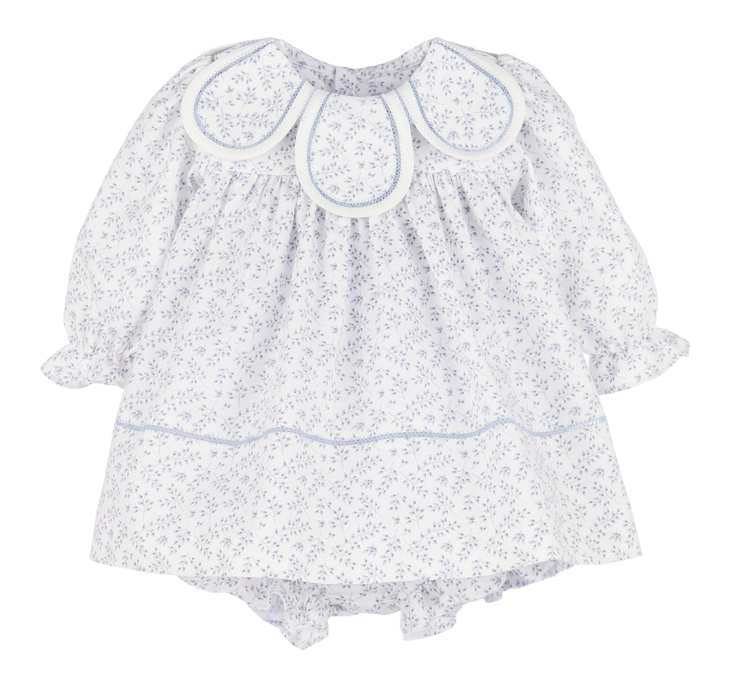 The Floral Branches Petal Float Dress from Sophie & Lucas brings a charming touch to your little one’s wardrobe with its delicate blue and white floral pattern. Its petal scalloped collar adds a sweet, elegant detail, while the back tie ensures a comfortable, adjustable fit. Available in sizes from infant to toddler, this dress is the ideal choice for family photos, capturing timeless memories with style and grace.