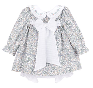 Dress your little one in the charming Bouncy Blooms Float Dress from Sophie &amp; Lucas. This delicate floral dress features an embroidered Peter Pan collar with ruffles, adding a sweet touch to every twirl. The coordinating bloomers provide comfort and ease for infants to toddler girls. Perfect for fall outings, its soft, breathable fabric and enchanting floral print make it a delightful choice for special moments and everyday wear.
