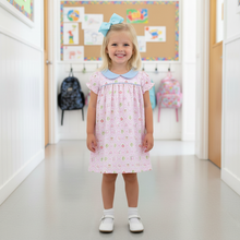 Load image into Gallery viewer, School Time Dress by Baby Loren features the brand's signature pima cotton material, timeless peter pan collar, and charming pastel school-themed print. Perfect for back-to-school season and special occasions, this dress combines comfort with classic style.
