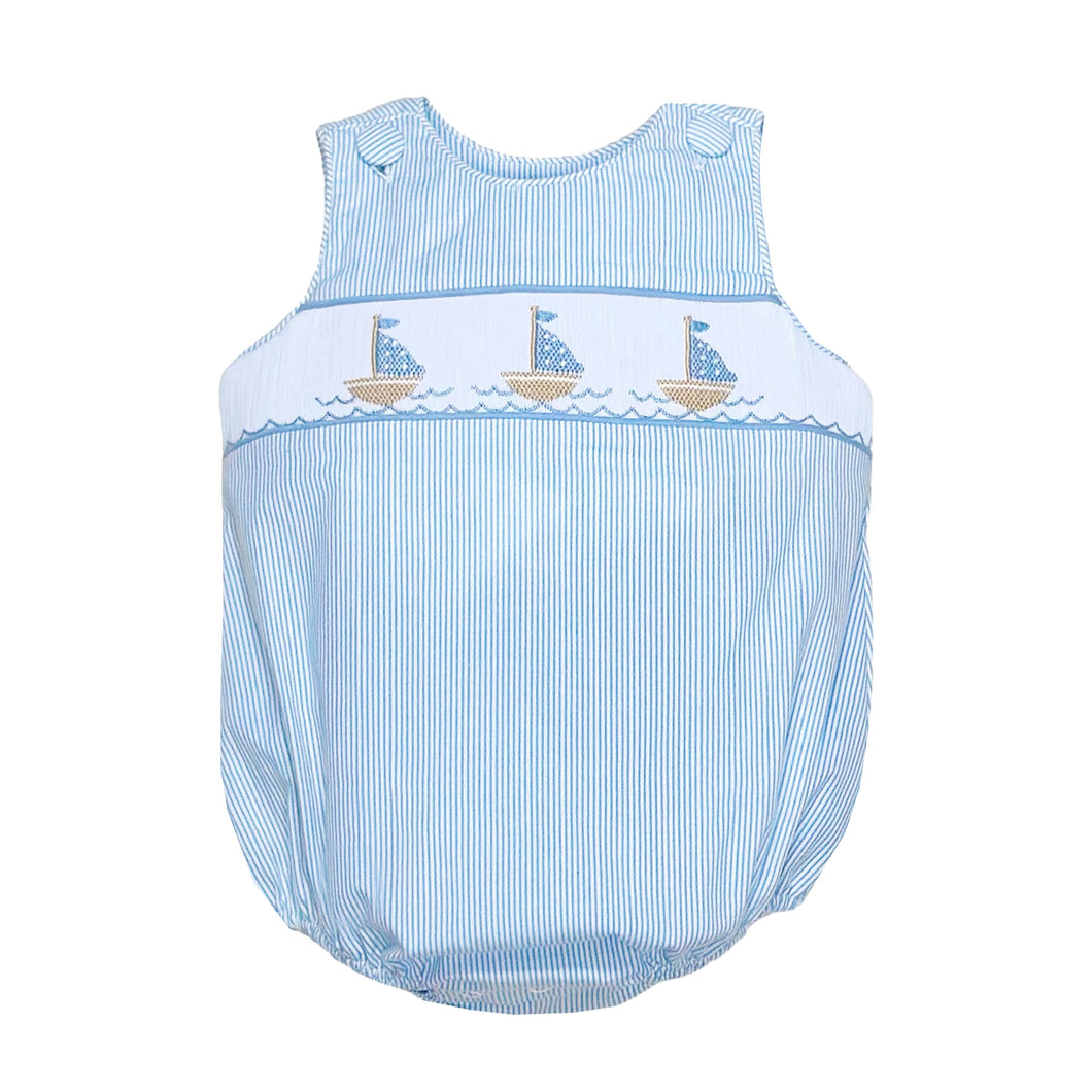 Sail into summer with our Infant Boy's Christopher Striped Sailboat Sunsuit! This charming outfit features delicate light blue and white seersucker stripes that keep your little one cool and stylish. The beautifully smocked front showcases adorable embroidered sailboats that capture the essence of seaside adventures. Complete your family photos with matching sibling sets from our Zuccini Kids collection – the perfect choice for beach days, special occasions, or simply looking precious!