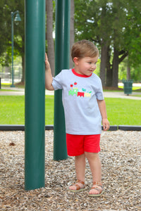 Transform your little boy's back-to-school excitement with this irresistible Trotter Street set! The blue and white striped tee showcases an adorable train applique hauling school supplies, perfectly paired with bright red shorts for a look that's both playful and stylish. Designed specifically for toddlers who love locomotives, this outfit will have your little conductor beaming with confidence as he chugs into the new school year. An absolute must-have for any train-loving tot!