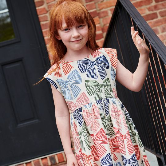 The Girls Adaline Dress in Multi Striped Bows brings a delightful mix of color and charm to your little girl’s wardrobe. Featuring playful striped bows, this dress adds a touch of whimsy while maintaining a stylish silhouette. Its comfortable fit ensures she can move freely, making it ideal for both special occasions and everyday wear. Elevate her look with a dress that combines fun patterns and effortless elegance.