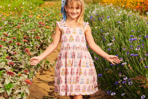 Elevate your little girl's wardrobe with the Girls Via Dress from Pink Chicken! This stylish dress features a charming pink flowerette design and ruffle straps making it perfect for any spring or summer event. Made with high-quality cotton materials, your child will feel comfortable and stylish all day long. Upgrade your tween's fashion game with this must-have dress!