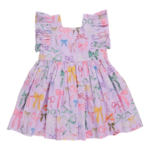 Effortlessly chic and stunning, our Girls Elsie Dress in Lavender Watercolor Bows from Pink Chicken will make your little one stand out in any crowd. The delicate flutter sleeves and charming mix of bows add a touch of elegance to the playful a-line silhouette. Perfect for any occasion, this dress will be a favorite in her wardrobe.