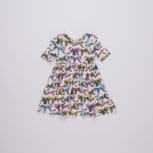 This Girls Bamboo Bows Steph Dress is perfect for little ones, made from soft bamboo material for added comfort. The dress is adorned with adorable bows, adding a touch of sweetness to any outfit. From Pink Chicken, this dress is both stylish and comfortable.