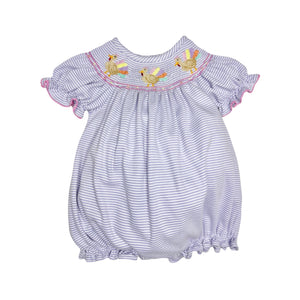 Dress your little one in playful charm with the Infant Girls Lavender Turkey Billie Bishop Bubble from Zuccini Kids. Soft lavender and white mini stripes create a gentle backdrop for the delightful smocked neckline, featuring colorful embroidered turkeys that add a whimsical touch. Comfortable and stylish, this bubble romper is perfect for keeping your infant cozy while standing out with unique, eye-catching details.