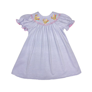 Celebrate Thanksgiving in style with the Girls Lavender Turkey Billie Bishop Dress from Zuccini Kids. This soft knit dress features charming lavender and white stripes and a delicate smocked neckline adorned with colorful embroidered turkeys. Comfortable and festive, it’s the perfect choice to make holiday moments memorable while keeping your little girl cozy and joyful.