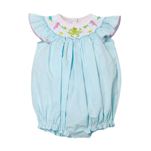 Dive into summer with the Under The Sea Billie Bishop Bubble from Zuccini Kids. This charming bubble features a refreshing teal and white check pattern complemented by an elegant bishop smocked neckline. Adorned with delightful embroidered sea animals, this outfit transforms everyday play into magical underwater adventures. Perfect for beach outings, summer parties, or simply making a splash at daycare!