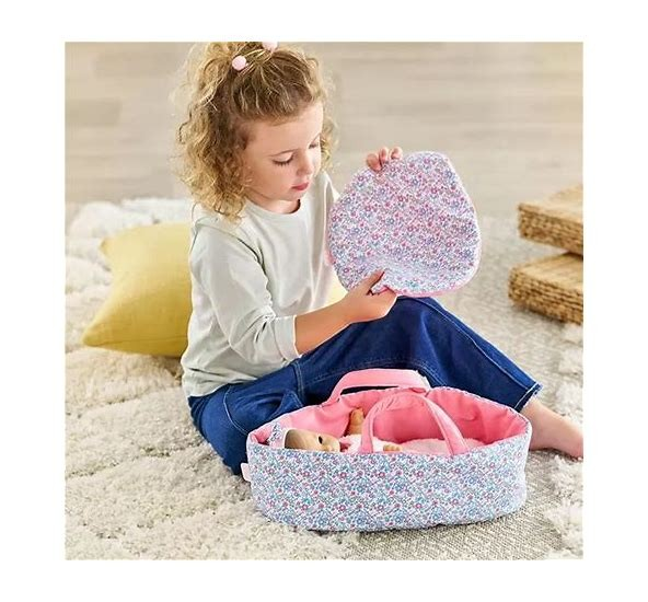 Inside this wonderfully soft cloth bed is plenty of space for your favorite 12-inch baby doll to rest comfortably, plus a thick double-sided blanket to keep them nice and warm. Ready to go? Just grab the carrying handles and head out the door! Toys. Dolls & Dollhouses. Pretend Play & Imaginative Play.