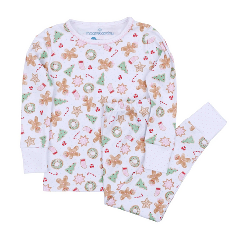 Dress your little one in cozy comfort and festive charm with this Girl's Frosted Wonderland Long Pajama Set . Made from 100% soft, breathable Pima Cotton, it gently caresses delicate skin while keeping your little one comfortable all day. The delightful all-over print of gingerbread girls, stars, and snowflakes adds a sweet holiday touch, making it the perfect choice for seasonal celebrations and cozy winter moments. Sibling matches available!
