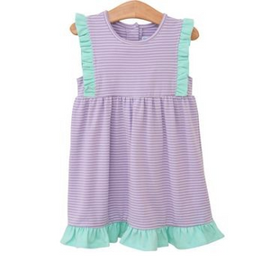 The Josie Dress from Trotter Street kids is the perfect playtime dress for toddler girls. Featuring a charming lavender and white stripe pattern with a playful mint ruffle detail and hem, this dress is both comfortable and stylish. Your little one will love wearing it every day!