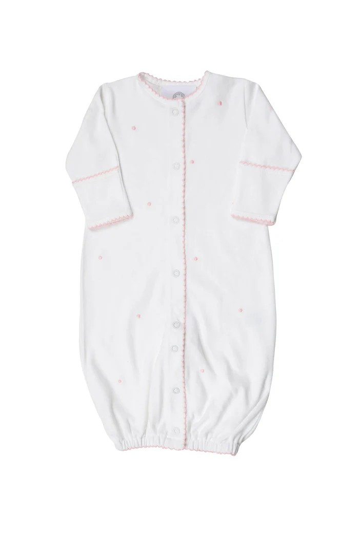 Introducing the Scallop Dot Converter- Pink Dots: a versatile and timeless gown for infant boys from The Proper Peony. With its unique design, this gown easily converts into a romper, providing both style and practicality. Made with love and care for your little one's comfort.