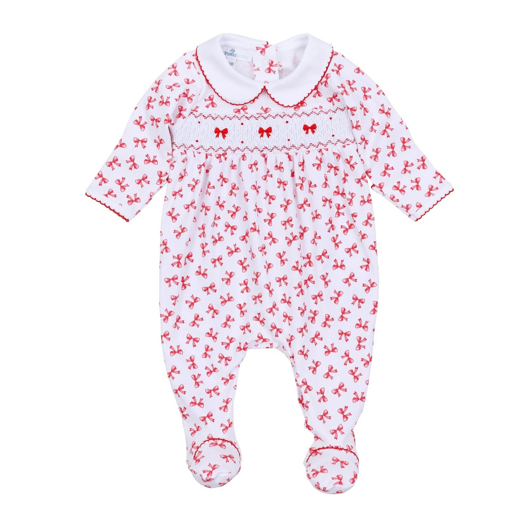 Dress your little one in the Infant Girls Scarlett Bows Smocked Footie, crafted from ultra-soft 100% Pima Cotton to keep delicate skin cozy and comfortable. Its charming red bows print adds a playful yet elegant touch, while the delicate smocked chest detail enhances its timeless appeal. Finished with refined red picot trim on the collar and cuffs, this footie blends classic style with everyday comfort effortlessly—perfect for your baby's most precious moments.