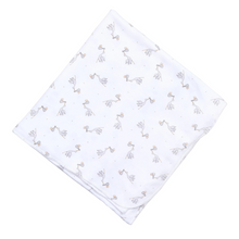 Load image into Gallery viewer, Wrap your little one in gentle comfort with the Magnolia Baby charming Worth the Wait Printed Swaddle Blanket! Crafted from luxurious Pima Cotton, this blanket embodies the tender inspiration of a new baby's arrival. Designed in a versatile white with a delicate grey stork print, it's perfect for any little one.
