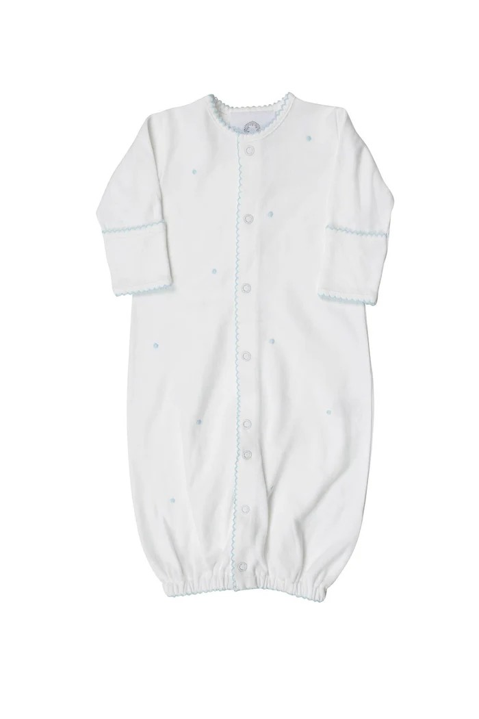 Introducing the Scallop Dot Converter- Blue Dots: a versatile and timeless gown for infant boys from The Proper Peony. With its unique design, this gown easily converts into a romper, providing both style and practicality. Made with love and care for your little one's comfort.