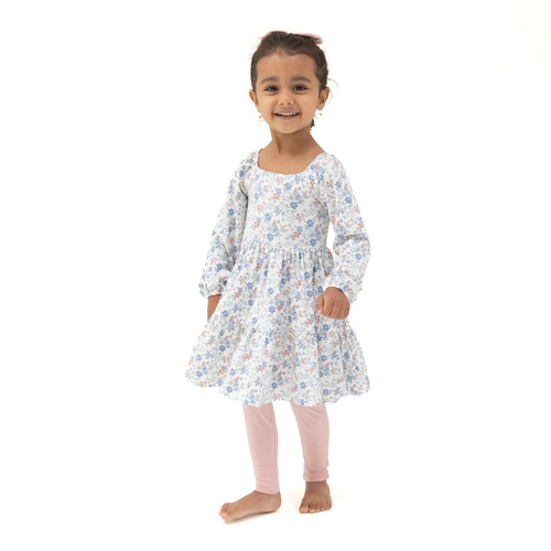 Dress your little one in comfort and charm with the Girls Floral Smocked Tunic and Legging Set from Angel Dear. This delightful outfit features a long-sleeve tunic with a smocked bodice adorned in a charming country floral pattern, paired perfectly with soft, coordinating pink leggings. Crafted from Angel Dear’s signature bamboo fabric, it offers gentle breathability and lasting softness, ensuring all-day comfort for your child. Perfect for playdates or family outings, this set combines style and practicali