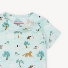 Load image into Gallery viewer, The Central Bark Pajama Short Set by Magnetic Me makes bedtime easy and fun with its playful puppy park design. Crafted from eco-friendly TENCEL™ modal fabric, these pajamas are soft, breathable, and gentle on your child’s skin. The innovative magnetic closure at the neck lets kids dress themselves effortlessly, eliminating the usual over-the-head struggles. Designed for a snug, comfortable fit, this set ensures a cozy night’s sleep while encouraging independence.
