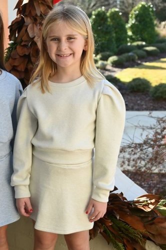 The Libba Sweater Skirt Snowflake from Pleat offers cozy warmth and charming style, perfect for everyday fall wear. Pair it with the Jane Sweatshirt in white to create a comfortable, effortlessly chic outfit that keeps her looking fresh and feeling snug all season long.