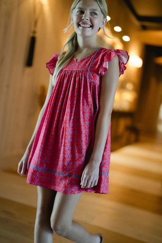 Get ready to add some playful charm to your little girl's wardrobe with the Girls Ellen Dress in Red & Purple! Made with a mix of cotton and viscose, this dress is not only comfortable but also easy to care for. The delicate flutter sleeves and purple trim add a touch of whimsy, making it perfect for any occasion. Machine wash cold and hang to dry for hassle-free maintenance.