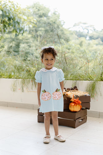 Dress your little one in cozy charm with the Pumpkin Amelia Dress from Zuccini Kids. This knit dress features delicate mint and white stripes, a sweet peter pan collar, and charming pumpkin appliques—perfect for keeping your toddler girl comfortable and stylish on cooler days. Its soft fabric and thoughtful design make it a must-have for your little girl's fall wardrobe.
