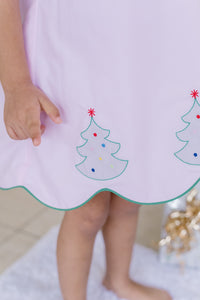 Celebrate the season in style with the Girl's Pink Christmas Tree Kendall Dress by Zuccini Kids. This charming light pink A-line dress features a delicate white peter pan collar with scalloped edges and intricate embroidery. Festive Christmas trees embroidered along the scalloped hem add a whimsical holiday touch, perfect for special occasions and holiday photos.&nbsp;