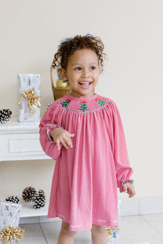 Pre-Order

Celebrate the season in cozy style with the Infant Girls Christmas Tree Billie Bishop Dress from Zuccini Kids. This charming knit dress features festive red and white stripes, complemented by a smocked neckline with embroidered delicate Christmas trees. Soft and comfortable, it’s perfect for your little one’s holiday moments. Plus, coordinating sibling outfits make for adorable family photos. 