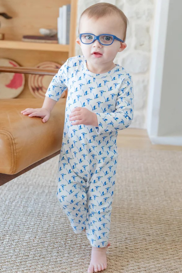 Crafted from ultra-soft Pima cotton, the Thompson Boys' Romper by Lila & Hayes offers gentle comfort for your little one. Featuring a timeless blue and white mallard duck print, this romper makes everyday lounging effortlessly stylish. Its breathable fabric ensures all-day coziness, while the easy-to-wear design keeps dressing simple for busy parents. Elevate your infant’s wardrobe with this charming and practical piece.