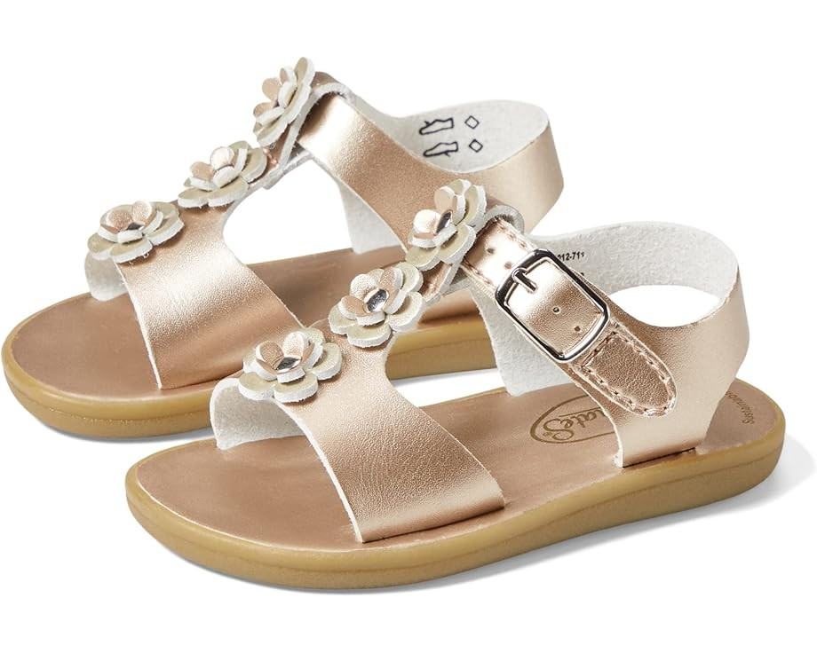 The Footmates Jasmine Sandals are a perfect combination of style and convenience. Made with leather and eco-friendly microfiber nappa uppers, they feature three double-flower appliques for a charming touch. The modern hook and loop straps, with false buckles, not only give the sandals a classic look but also make it easy for your child to put them on and take them off independently.