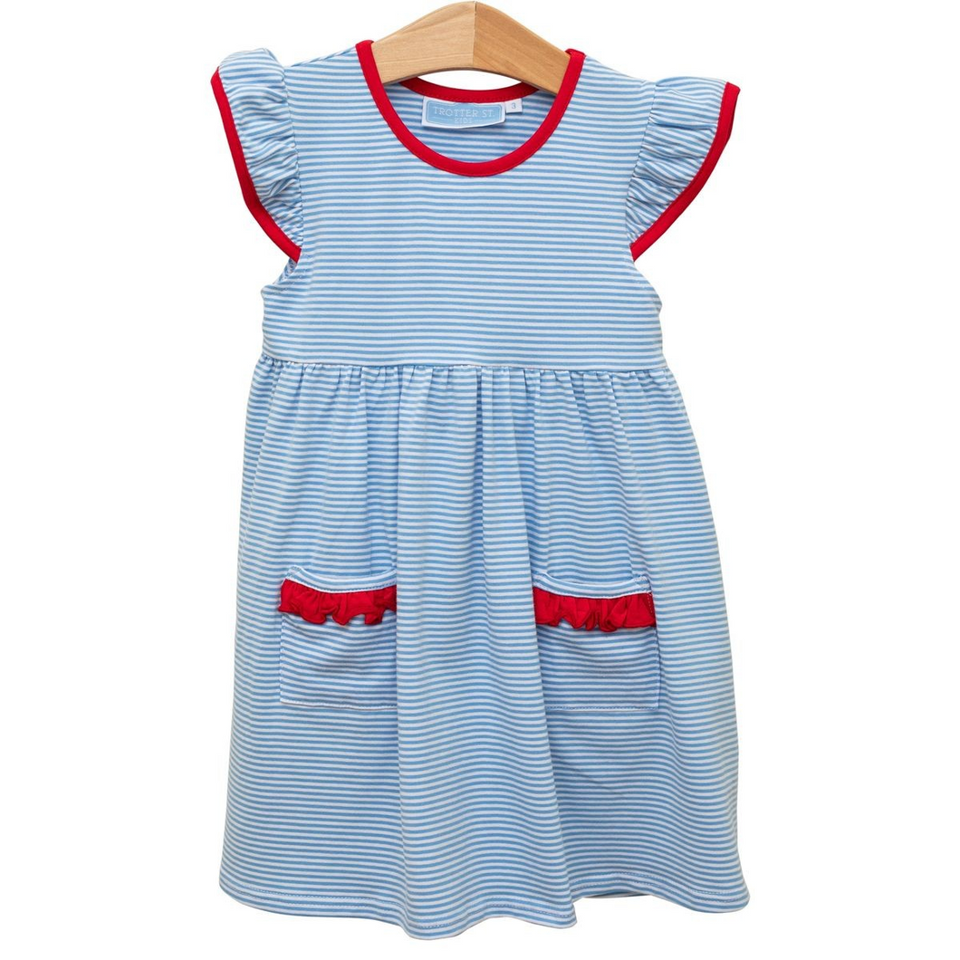 Introducing the Lucy Dress by Trotter Street Kids! This adorable everyday play dress is perfect for toddler girls. Made with soft cotton, it features a charming cornflower blue and white stripe pattern with pops of vibrant red detail. Dress your little one in comfort and style.