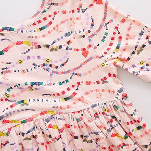 In our Friendship Bracelet Era! This exclusive new print from Pink Chicken, inspired by your favorite superstar, is a must-have for your stylish kiddos. This nostalgic print highlights positive messaging such as kindness, happiness and friendship - and is the perfect dress for class, a playdate, but most of all, your next concert. The classic Steph Dress silhouette is loved for its super swingy fully gathered skirt and skinny sleeve that hits right above the elbow. The soft and silky bamboo fabric is best k